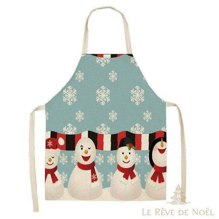 Tablier de cuisine bleu clair avec une rangée de bonhommes de neige souriants et des flocons
