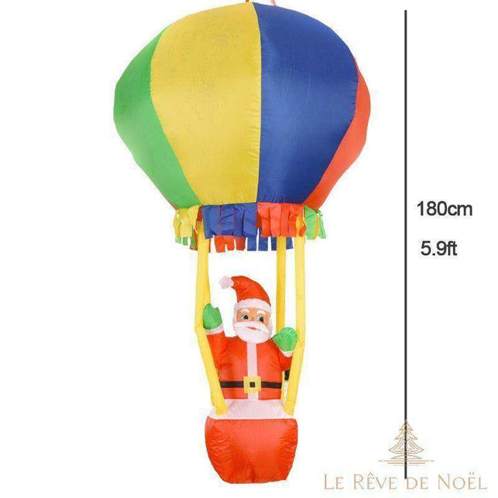 Père Noël gonflable dans une montgolfière multicolore, bras levés, hauteur 180 cm, fond blanc