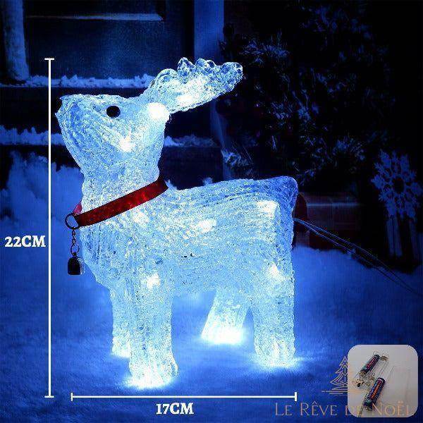 Renne acrylique lumineux dans la neige, collier rouge, pictogramme piles en médaillon