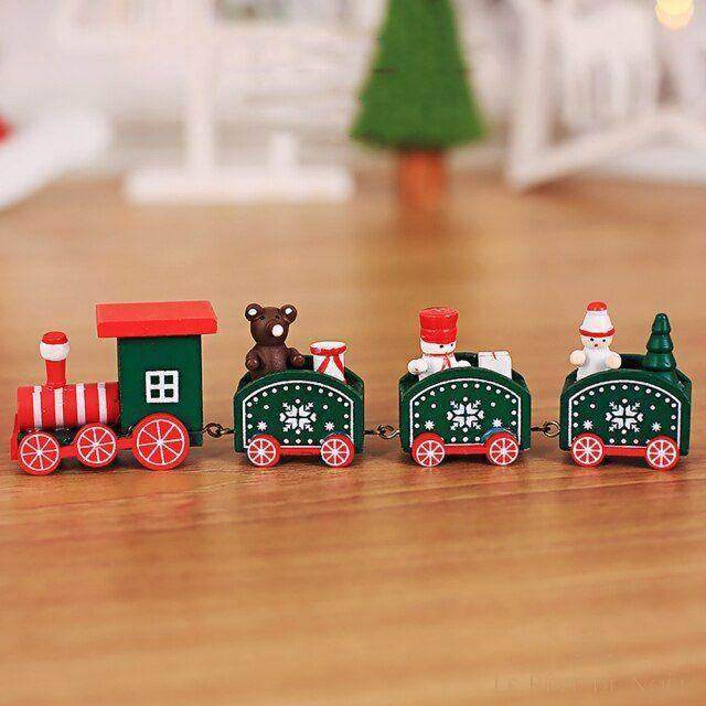 Petit train de Noël en bois vert à roues rouges, wagons avec ourson, soldat et Père Noël miniatures