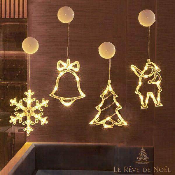 Guirlandes lumineuses néon à ventouse : flocon, cloche, sapin et Père Noël illuminés sur un mur